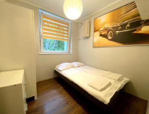 Llit o llits en una habitació de Forest - 23 Marca Sopot by Grand Apartments