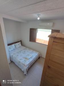 Postel nebo postele na pokoji v ubytování Chalé dos Milagres 01