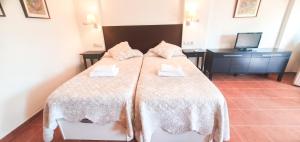 Posteľ alebo postele v izbe v ubytovaní Skol 329 – Spacious Beachfront Studio with Sea Views