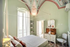 En eller flere senge i et værelse på Lu Poggiulu - Le Case di Valentina