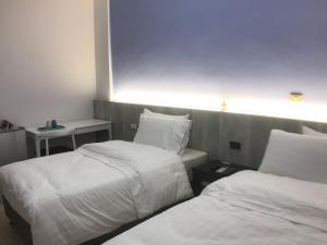 三丘民宿客房内的一张或多张床位