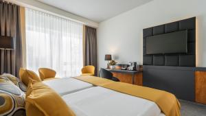Rúm í herbergi á Dorint Hotel Dresden