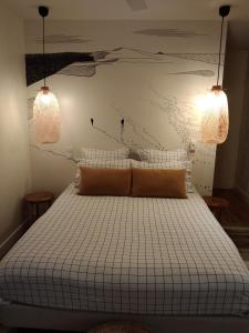 Postel nebo postele na pokoji v ubytování Hotel Home Arcachon