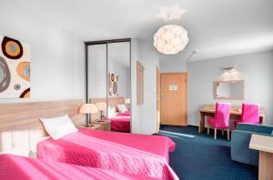 Posteľ alebo postele v izbe v ubytovaní Hotel Petrus