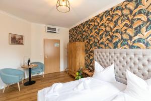 Postel nebo postele na pokoji v ubytování Hotel Kaiserhof