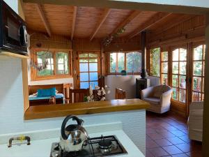a kitchen with a stove top oven in a room at Cabañas Caballieri in Pisco Elqui