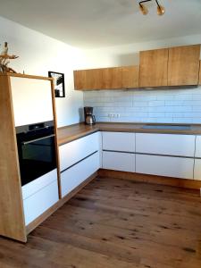 Cuisine ou kitchenette dans l'établissement Ferienhaus - Am Waldrand