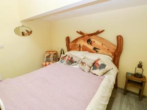 En eller flere senger på et rom på Lime Kiln Cottage