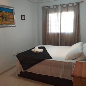 Postel nebo postele na pokoji v ubytování Apartamento cerca de la playa La Mata