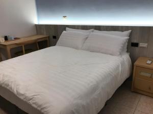 三丘民宿客房内的一张或多张床位