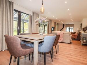 a dining room with a table and chairs at Primrose in Bodmin