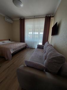 Posteľ alebo postele v izbe v ubytovaní Dvir Litynskyi