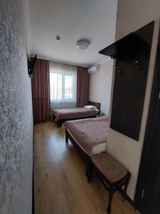 Posteľ alebo postele v izbe v ubytovaní Dvir Litynskyi