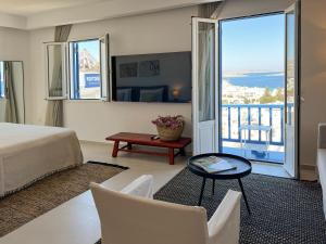 Uma TV ou centro de entretenimento em Portobello Boutique Hotel