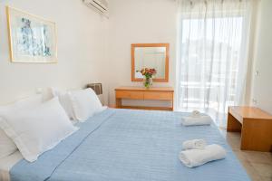 Postel nebo postele na pokoji v ubytování Hotel Arethousa