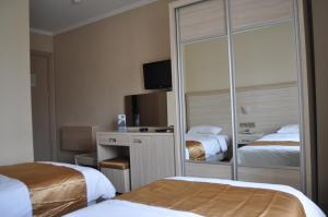 Кровать или кровати в номере Arapgir Nazar Hotel