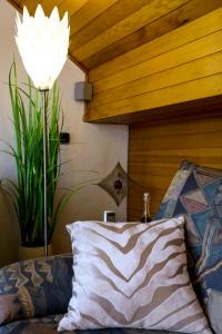 a room with a bed with a pillow and a lamp at Ferienwohnung Jepsen in Glücksburg