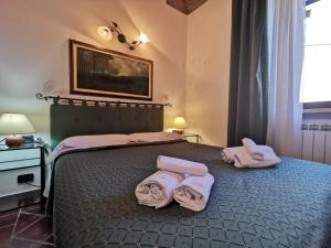 Postel nebo postele na pokoji v ubytování Saturnia Residence