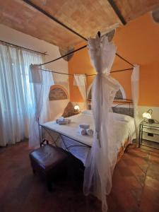 Postel nebo postele na pokoji v ubytování Saturnia Residence