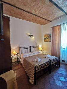 Postel nebo postele na pokoji v ubytování Saturnia Residence