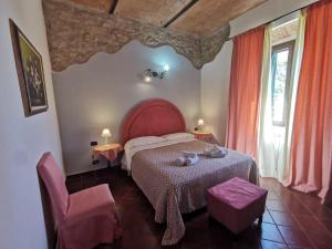 Postel nebo postele na pokoji v ubytování Saturnia Residence