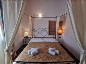 Postel nebo postele na pokoji v ubytování Saturnia Residence