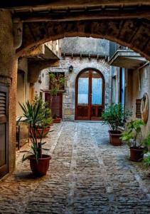 an entrance to a building with a door and potted plants at Stella marina in Castellammare del Golfo