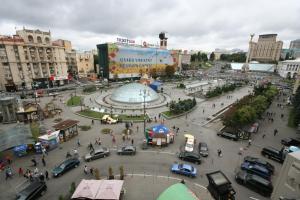 a city with a large plaza with cars and people at Real Home Apartments in Kiev Center in Kyiv