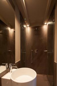 a bathroom with a shower and a sink and a sink at Hotel Dei Dragomanni in Venice