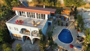 an aerial view of a house with a swimming pool at Villa kaplumba in Dalyan