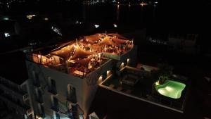 an overhead view of a restaurant at night with lights at Hotel Isla de Flores in Flores