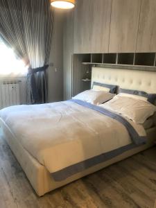 A bed or beds in a room at La Casa di Gio Golf Tennis e parcheggio privato