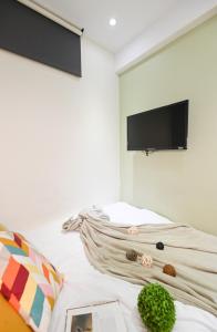 TV a/nebo společenská místnost v ubytování 在家行旅 中山館