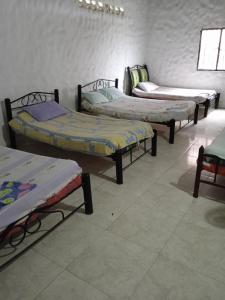 Un pat sau paturi într-o cameră la Posada la tranquilidad