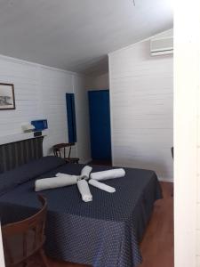 Un pat sau paturi într-o cameră la Hotel Paradiso Dei Giovani