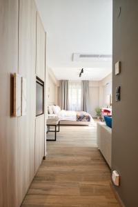 Postel nebo postele na pokoji v ubytování The Mavili urban stay