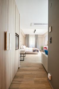 The Mavili urban stay tesisinde bir odada yatak veya yataklar