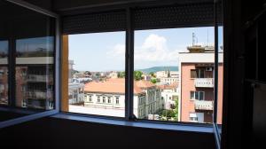 a view of a city from an office window at Apartman Filimena in Kruševac