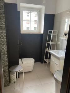 Kúpeľňa v ubytovaní Apartament Centrum Msciwoja
