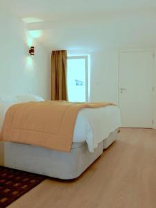 Ένα ή περισσότερα κρεβάτια σε δωμάτιο στο Consuls Ocean View