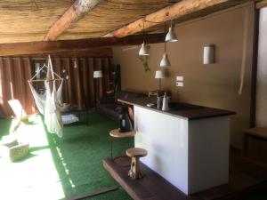 a kitchen with a counter in a room at Ô Lit' Chi in Hermillon