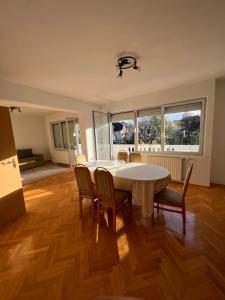 a dining room with a table and chairs at Villa ''M&A'' in Sarajevo