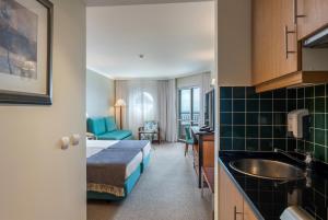 Cama ou camas em um quarto em Pestana Grand Ocean Resort Hotel
