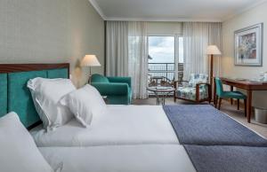 Cama ou camas em um quarto em Pestana Grand Ocean Resort Hotel