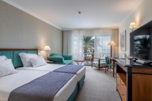 Cama ou camas em um quarto em Pestana Grand Ocean Resort Hotel