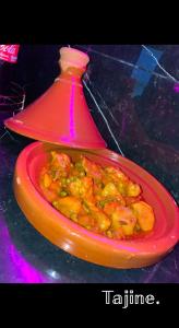 a red plate of food on a table at RR Jacuzzi in Saint-Laurent-des-Arbres