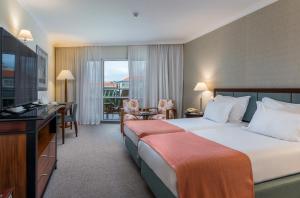 Cama ou camas em um quarto em Pestana Grand Ocean Resort Hotel