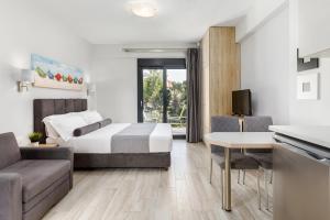 Postel nebo postele na pokoji v ubytování Ilis Villas + 22 fotografií