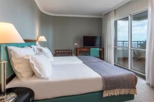 Cama ou camas em um quarto em Pestana Grand Ocean Resort Hotel