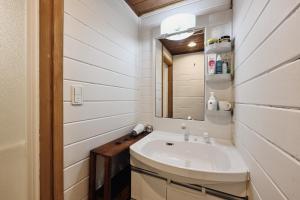 a bathroom with a sink and a mirror at LOGIN OKlNAWA -counrty- in Onna +28 photos